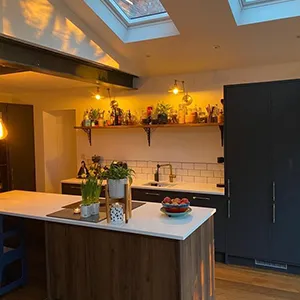 a kitchen with a center island and a skylight