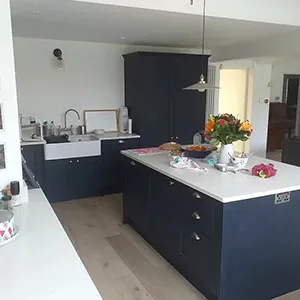 a large kitchen with a center island and a sink