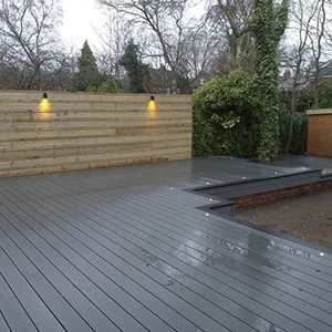 a large wooden deck with lights on it