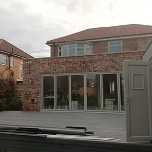 a house with a large patio and a deck