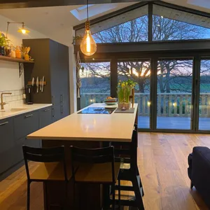 a kitchen with a table, chairs and a couch