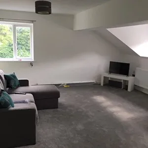 a living room with a couch and a television