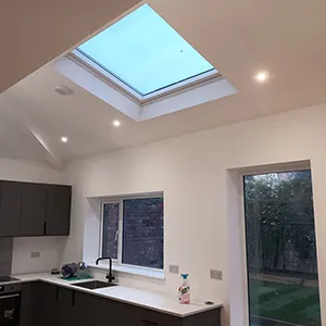 a kitchen with a skylight above it