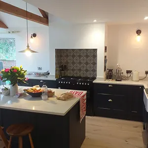 a kitchen with a center island and a breakfast bar